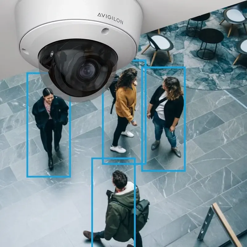 An AI CCTV camera installed in a retail storage unit using smart vision technology to scan the area.